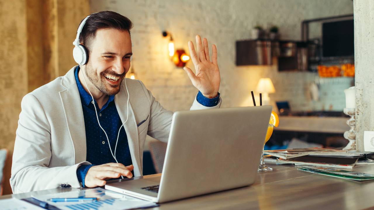 Man with headphones having a video meeting