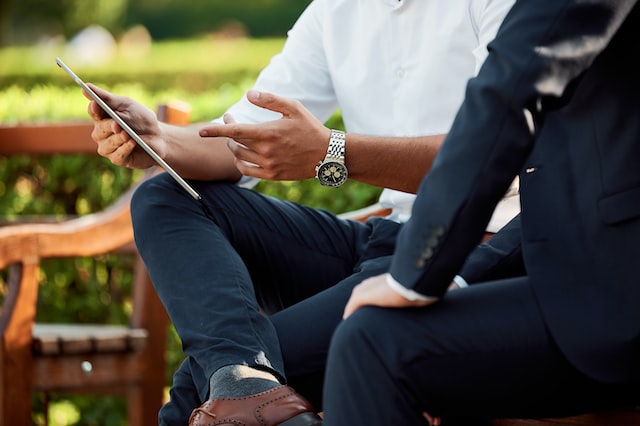 Two men discussing time tracking app