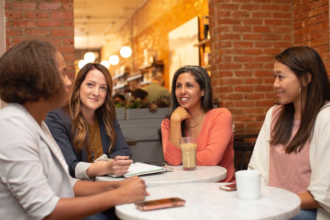 Professional woman chatting at table