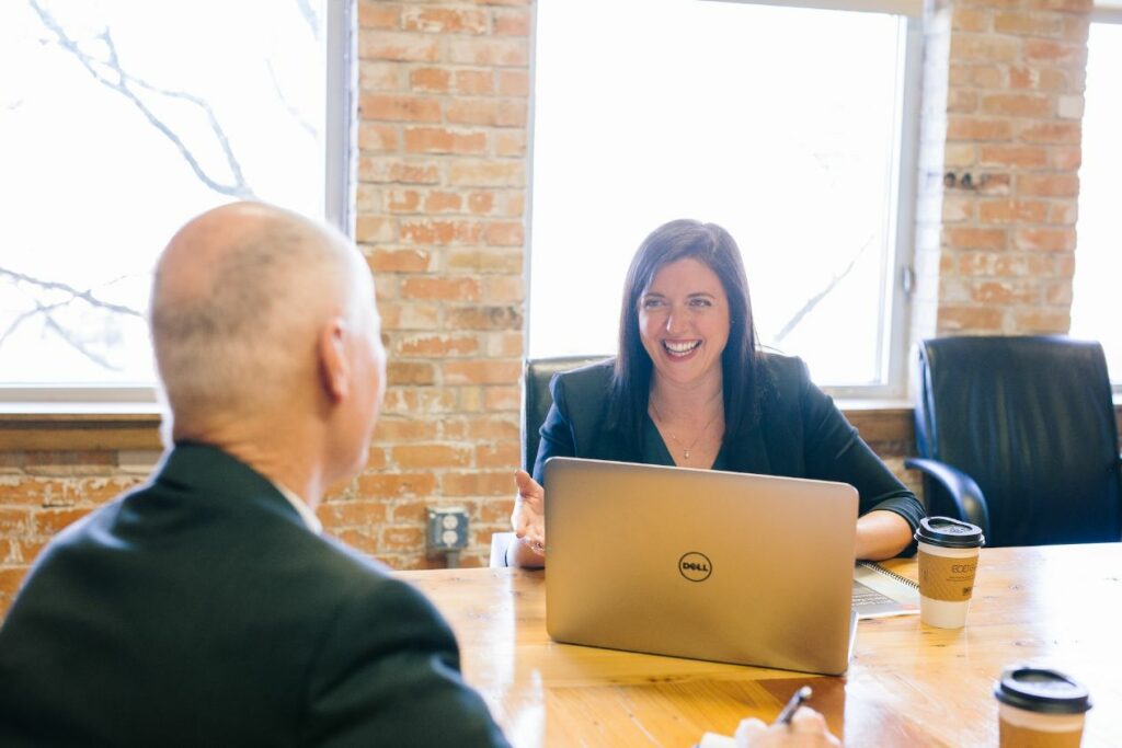 Smiling woman with a laptop