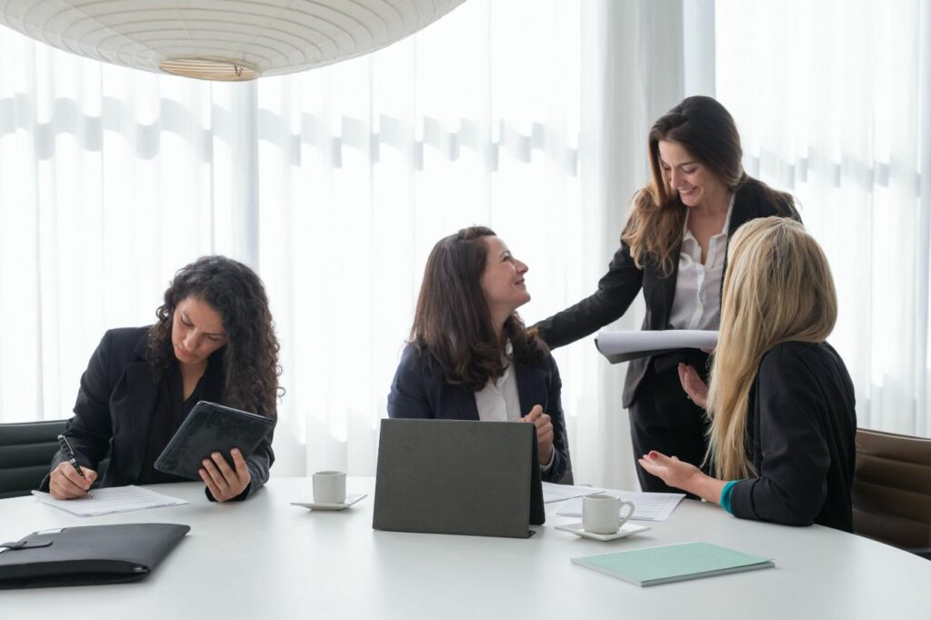 Women talking in boardroom