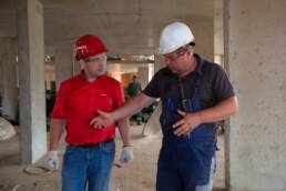 Construction workers talking