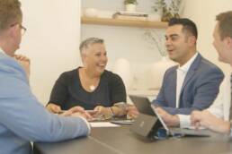 Group of project managers chatting in office