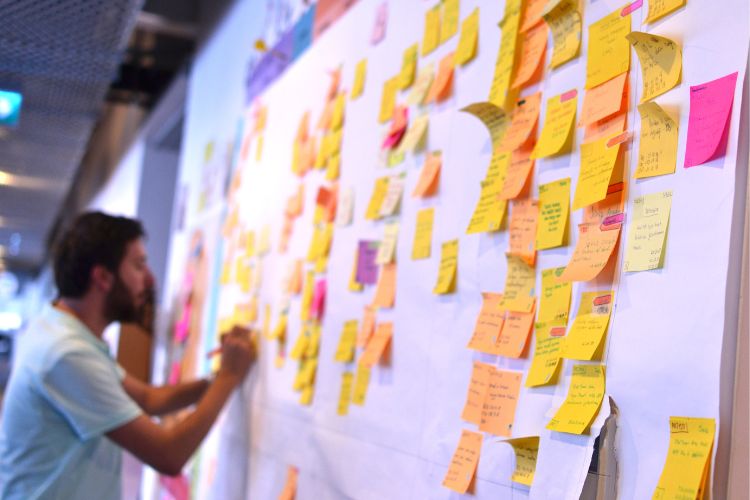 Man using an agile board to manage a project