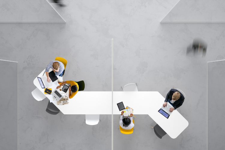 Colleagues working at a desk in an office