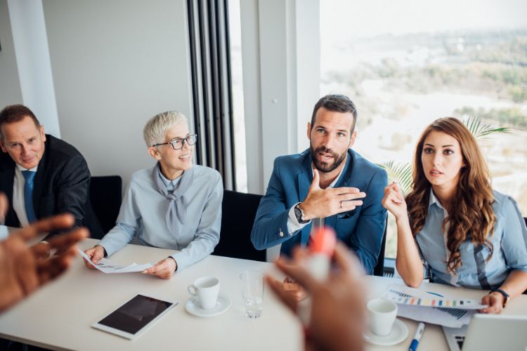 Business men and women having a meeting