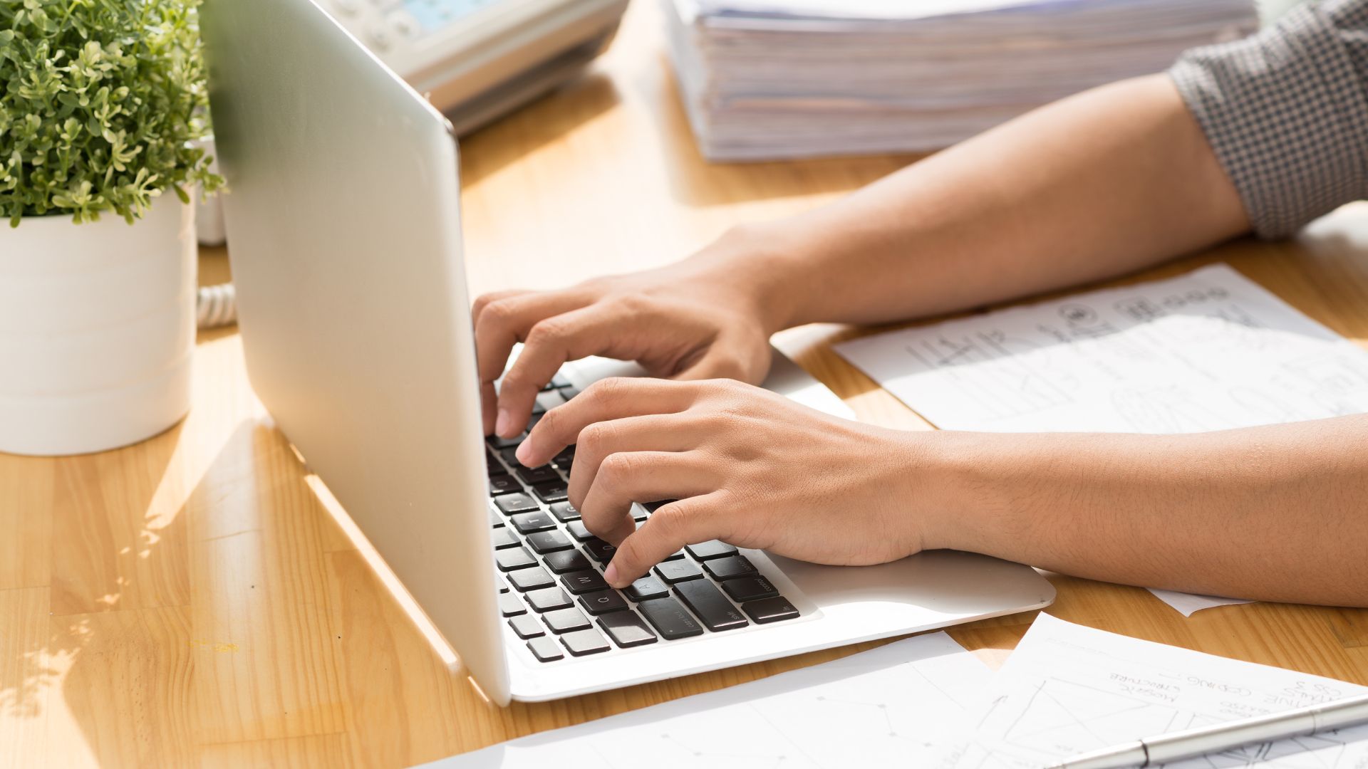 writing resume on laptop