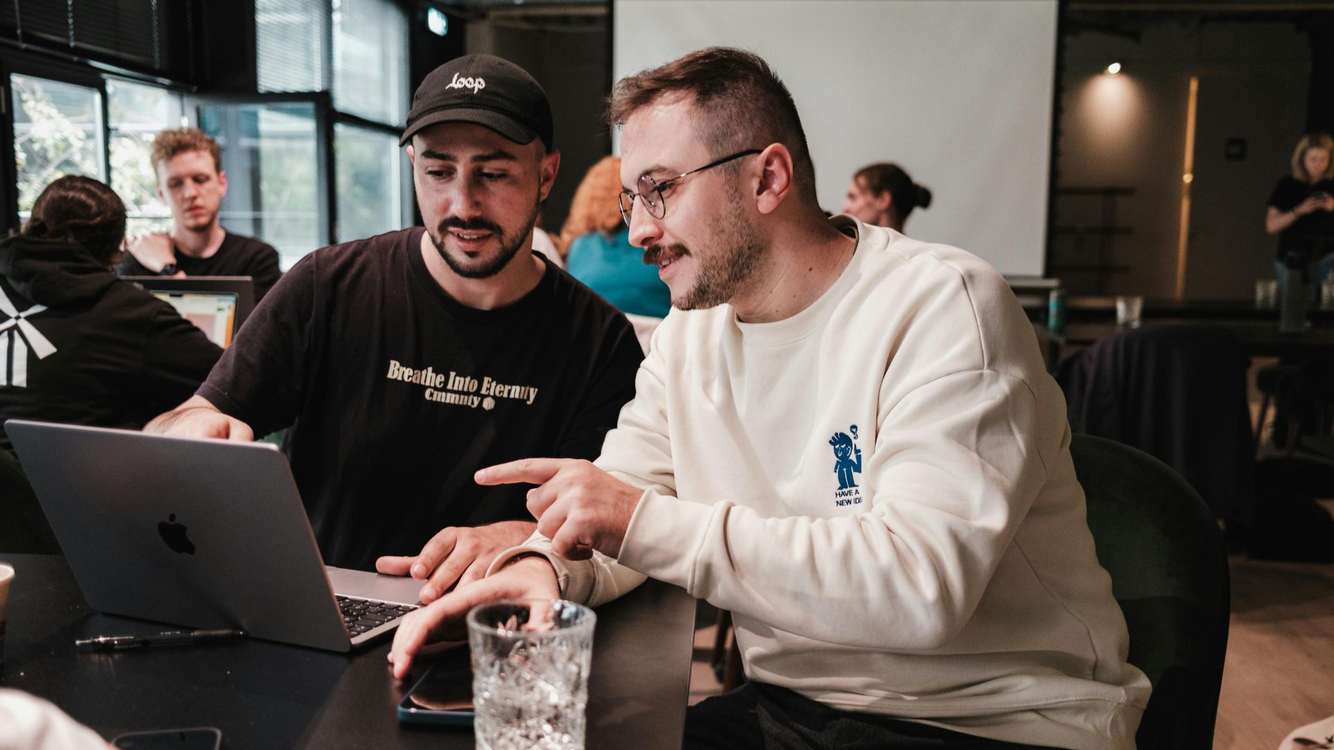 leader working with employee at a cafe